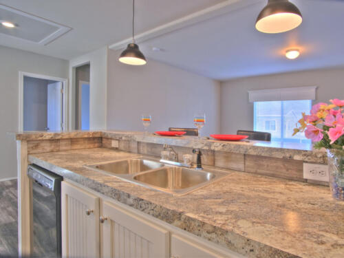 A kitchen with granite counter tops and a sink.